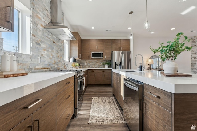 1618 S Main St Unit 2, Salt Lake City, UT 84115 - kitchen with sink, ventilation hood, hanging light fixtures, stainless steel appliances, and decorative backsplash