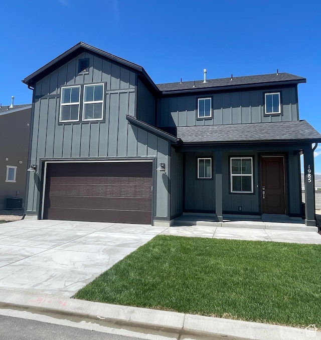 view of front of house with cooling unit, a shingled roof, board and batten siding, concrete driveway, and an attached garage