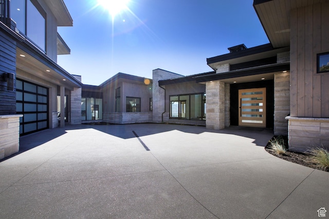 2066 E Oquirrh Mountain Cir, Heber City, UT 84032 - view of patio with a garage