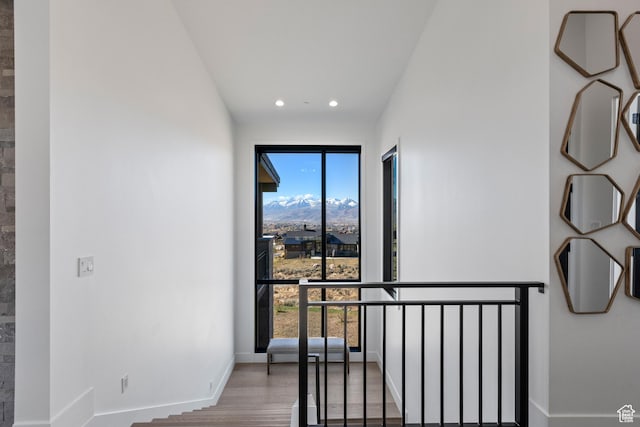2066 E Oquirrh Mountain Cir, Heber City, UT 84032 - staircase with wood finished floors, recessed lighting, a healthy amount of sunlight, and baseboards