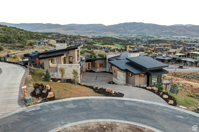 2066 E Oquirrh Mountain Cir, Heber City, UT 84032 - exterior space with a mountain view, metal roof, and a chimney