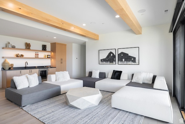 2066 E Oquirrh Mountain Cir, Heber City, UT 84032 - living room featuring beamed ceiling, light wood-type flooring, visible vents, recessed lighting, and indoor wet bar