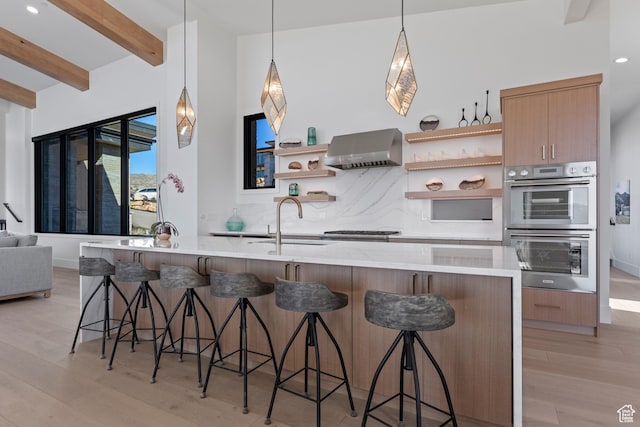2066 E Oquirrh Mountain Cir, Heber City, UT 84032 - kitchen featuring a sink, stainless steel appliances, wall chimney exhaust hood, and open shelves