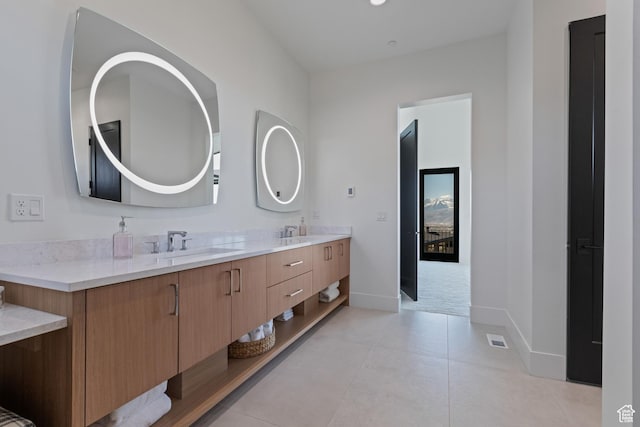 2066 E Oquirrh Mountain Cir, Heber City, UT 84032 - bathroom with double vanity, visible vents, tile patterned floors, and a sink
