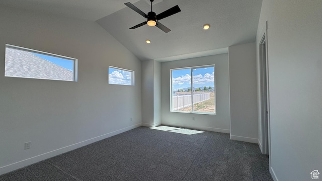 carpeted empty room featuring baseboards, recessed lighting, vaulted ceiling, and a ceiling fan