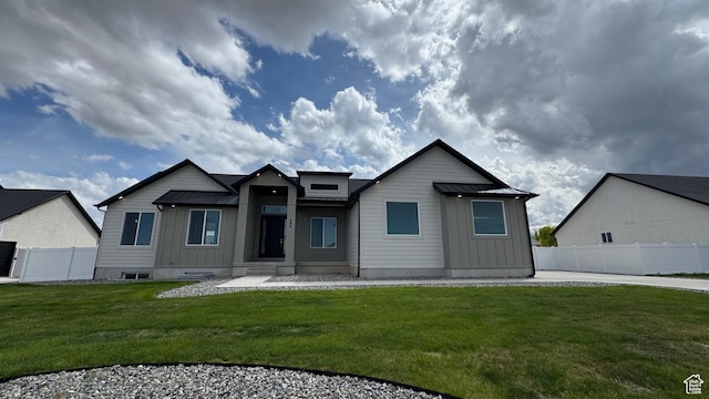 view of front of house featuring board and batten siding, metal roof, and a standing seam roof
