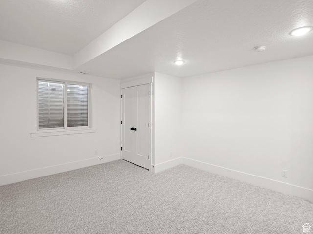 9749 N Hibiscus Ln, Eagle Mountain, UT 84005 - unfurnished room featuring light carpet, baseboards, a textured ceiling, and a smoke detector
