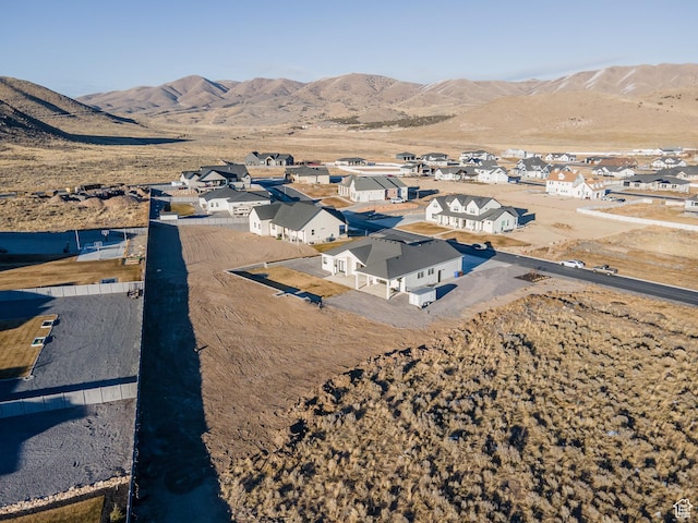 9749 N Hibiscus Ln, Eagle Mountain, UT 84005 - aerial perspective of suburban area featuring a mountainous background