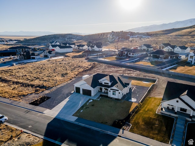 9749 N Hibiscus Ln, Eagle Mountain, UT 84005 - aerial perspective of suburban area with a mountainous background