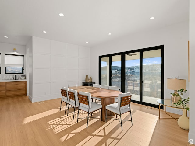 9749 N Hibiscus Ln, Eagle Mountain, UT 84005 - dining room with light wood-type flooring and recessed lighting