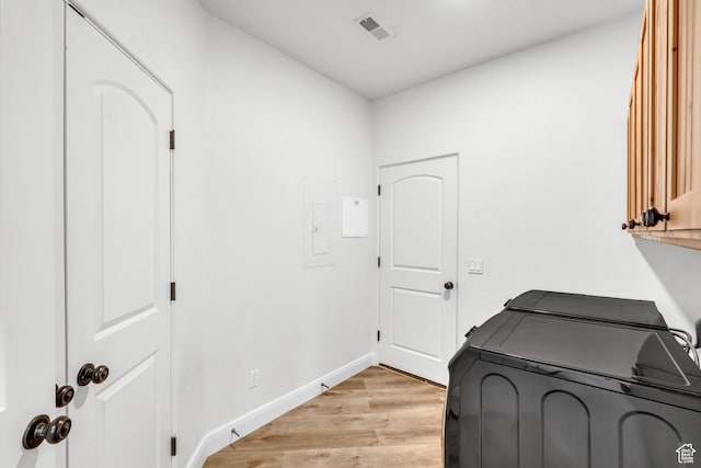 235 W Golden Eagle Cir, St George, UT 84770 - clothes washing area with separate washer and dryer, cabinets, and light wood-type flooring