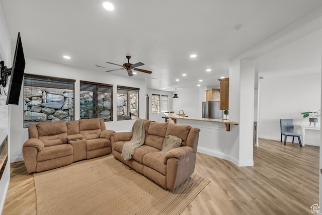 235 W Golden Eagle Cir, St George, UT 84770 - living room featuring light hardwood / wood-style flooring and ceiling fan