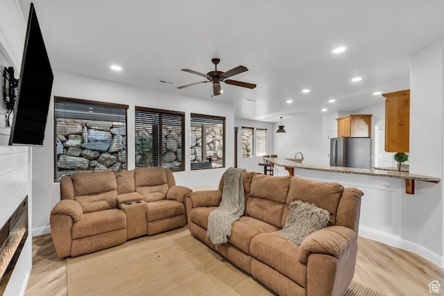 235 W Golden Eagle Cir, St George, UT 84770 - living room with ceiling fan and light hardwood / wood-style floors