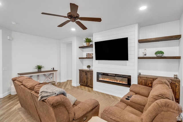 235 W Golden Eagle Cir, St George, UT 84770 - living room with ceiling fan, a fireplace, and light hardwood / wood-style floors