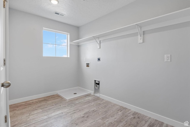 4421 W 150 N, West Point, UT 84015 - clothes washing area with hookup for a washing machine, light wood-type flooring, hookup for an electric dryer, and a textured ceiling