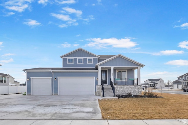 4421 W 150 N, West Point, UT 84015 - view of front of property featuring a garage, a porch, and a front lawn