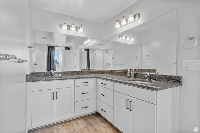 4421 W 150 N, West Point, UT 84015 - bathroom featuring vanity, hardwood / wood-style flooring, and walk in shower