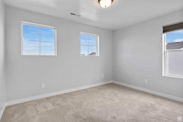 4421 W 150 N, West Point, UT 84015 - unfurnished room with light colored carpet and a textured ceiling