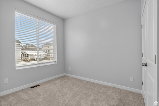 4421 W 150 N, West Point, UT 84015 - spare room featuring light colored carpet and a textured ceiling