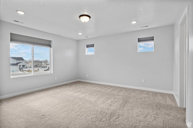 4421 W 150 N, West Point, UT 84015 - spare room featuring carpet and a textured ceiling