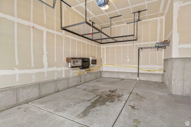4421 W 150 N, West Point, UT 84015 - garage featuring a garage door opener, heating unit, and a wall mounted AC