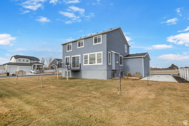 4421 W 150 N, West Point, UT 84015 - rear view of property featuring a balcony and a lawn