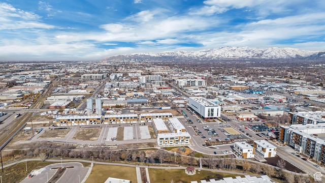birds eye view of property with a view of city and a mountain view