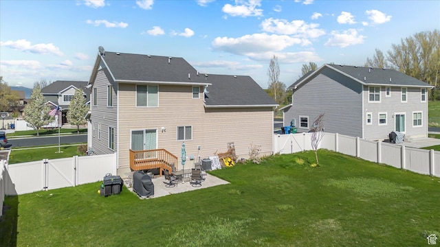 820 S 525 E, River Heights, UT 84321 - back of property featuring a fenced backyard, a gate, a patio, and a lawn