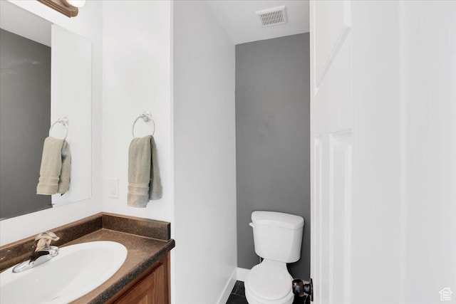 820 S 525 E, River Heights, UT 84321 - bathroom with visible vents, baseboards, toilet, and vanity