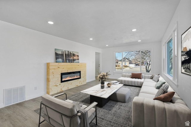 448 N 900 W, Salt Lake City, UT 84116 - living room with baseboards, visible vents, wood finished floors, and a glass covered fireplace