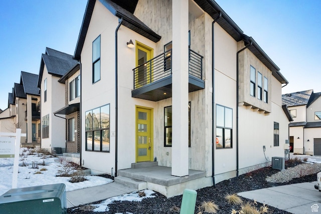 view of snowy exterior with central AC