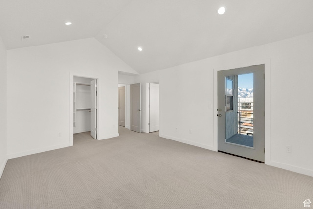 103 E 1760 N, Heber City, UT 84032 - unfurnished bedroom featuring a walk in closet, vaulted ceiling, light carpet, access to outside, and a closet
