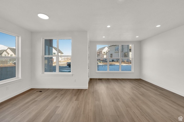 103 E 1760 N, Heber City, UT 84032 - unfurnished living room with light hardwood / wood-style floors and a wealth of natural light