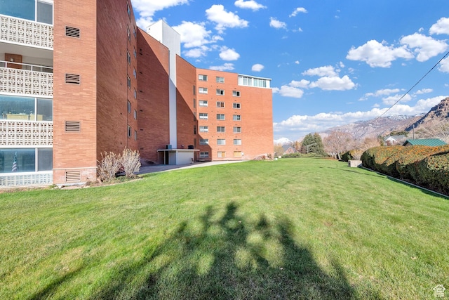 view of apartment building / complex with a mountain view