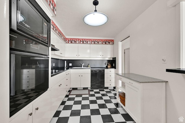 kitchen featuring black appliances, a sink, white cabinetry, under cabinet range hood, and dark flooring