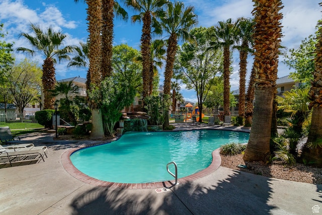 view of swimming pool featuring a patio area and pool water feature
