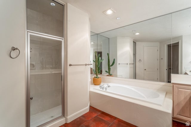 bathroom featuring vanity, plus walk in shower, and tile patterned flooring