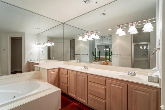 bathroom featuring vanity, tile patterned flooring, and shower with separate bathtub