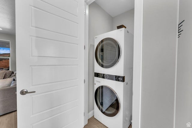 1439 N Arena Roja Dr, Washington, UT 84780 - laundry room with stacked washer and dryer and light wood-type flooring