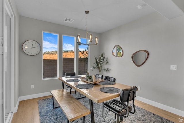 1439 N Arena Roja Dr, Washington, UT 84780 - dining space featuring hardwood / wood-style floors and an inviting chandelier
