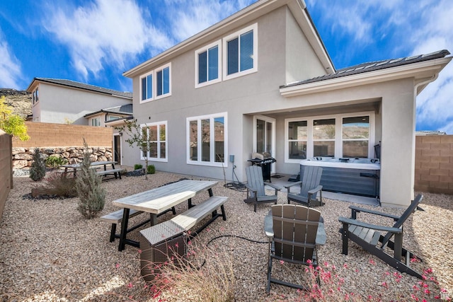 1439 N Arena Roja Dr, Washington, UT 84780 - rear view of property featuring a patio area and a hot tub