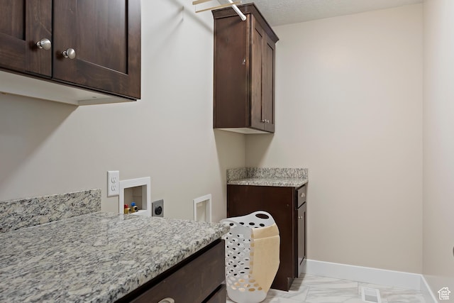 1407 N Mountain Rd, Ogden, UT 84404 - washroom featuring hookup for a washing machine, cabinets, and hookup for an electric dryer