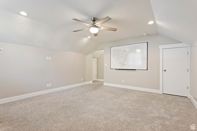 1407 N Mountain Rd, Ogden, UT 84404 - additional living space with lofted ceiling, ceiling fan, carpet floors, and a textured ceiling