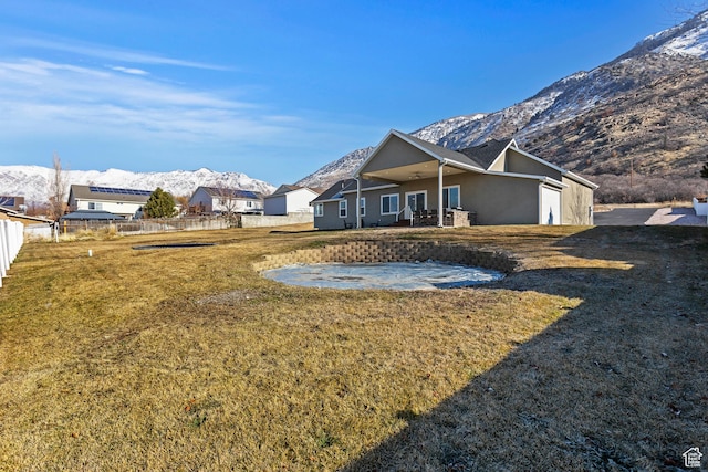 1407 N Mountain Rd, Ogden, UT 84404 - back of house with a mountain view and a yard