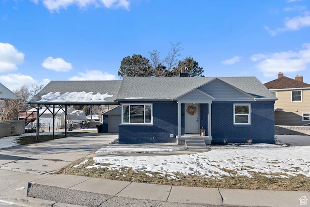 view of front of property featuring a carport