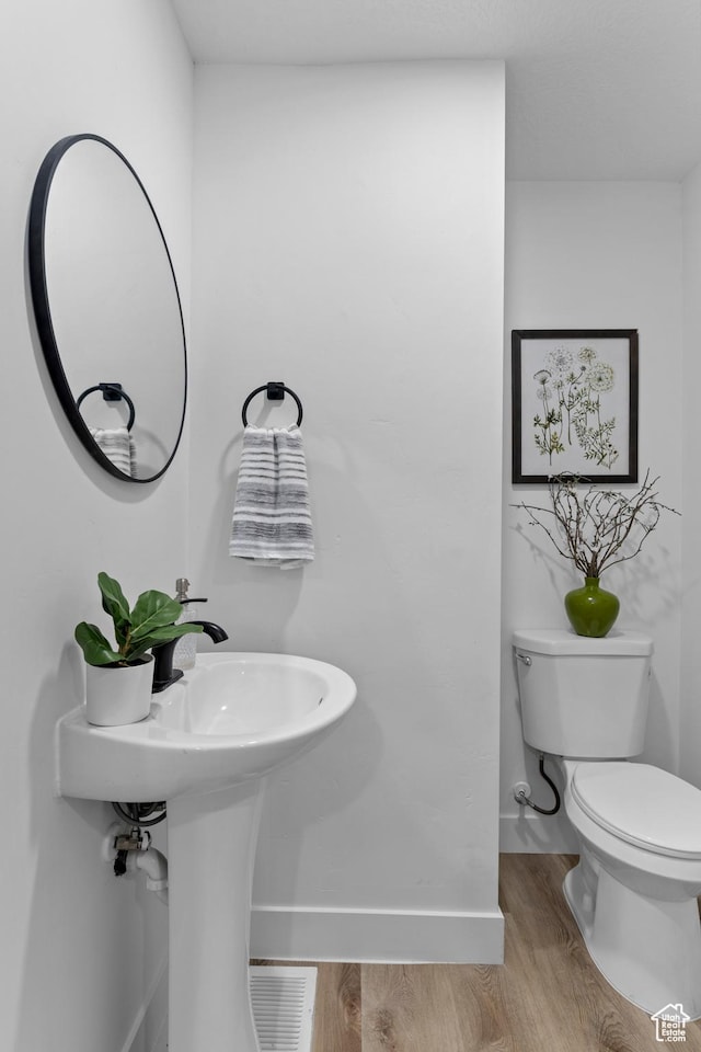 2386 E Lakeview Dr S, Millcreek, UT 84109 - bathroom with hardwood / wood-style flooring and toilet