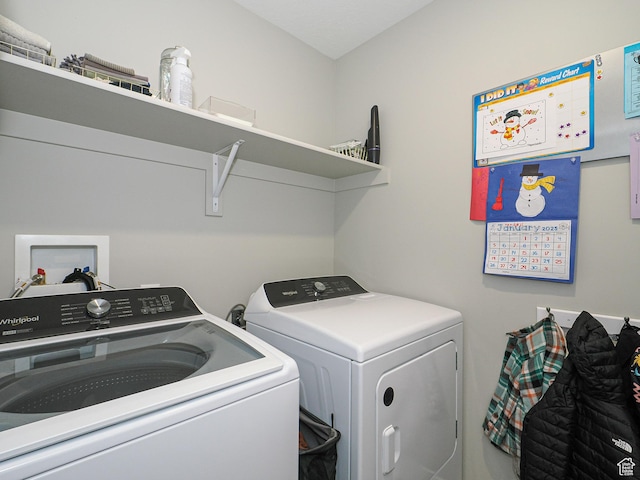 clothes washing area with laundry area and washing machine and clothes dryer