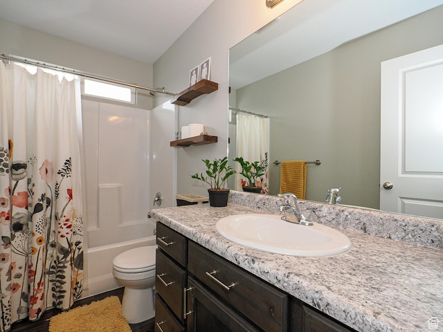 full bathroom featuring toilet, vanity, and shower / bath combination with curtain