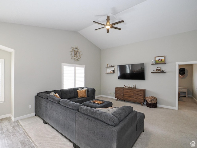 living room with vaulted ceiling, baseboards, and ceiling fan