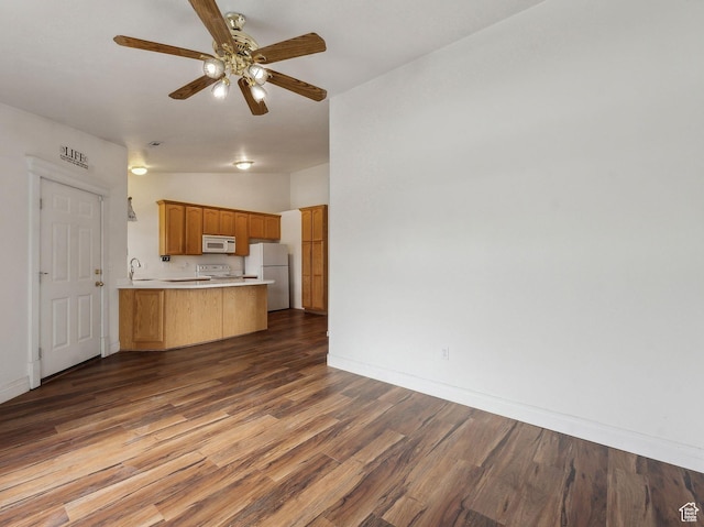 3859 S Mitchell Cv E Unit 203, South Salt Lake, UT 84115 - kitchen featuring kitchen peninsula, sink, white appliances, ceiling fan, and dark hardwood / wood-style floors